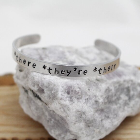 *There *They're *Their - Hand Stamped Anodized Aluminum Bangle - Adjustable - Picture 1 of 14